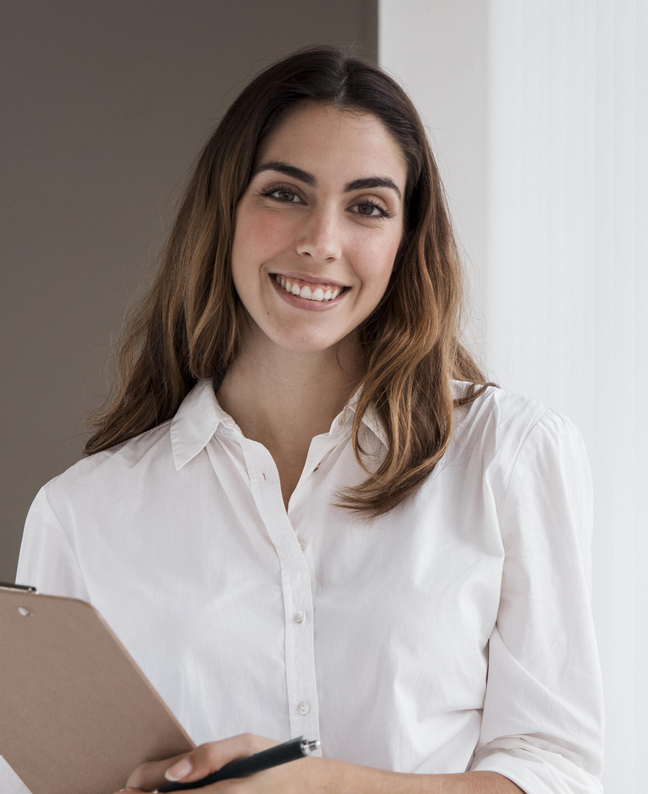 front-view-elegant-businesswoman-holding-clipboard-scaled.jpg